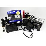 Various binoculars and cameras, to include a pair of Zisslar Telinor 8x26 binoculars,