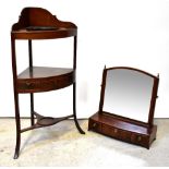 A 19th century swivel mahogany toilet mirror with Corinthian columns on three-drawer base,