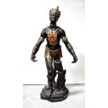 A large fibreglass figure of a South American warrior with hands outstreched, height 173cm.
