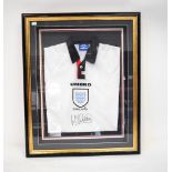 MICHAEL OWEN: an Umbro England shirt signed by Michael Owen, framed and glazed, 77 x 63cm.