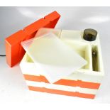 A vintage plastic stackable Pac-A-Pic picnic set of box form with four trays.