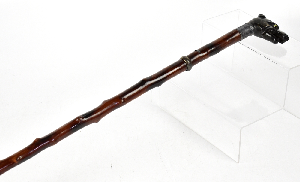 A late 19th early 20th century blackthorn walking stick with carved wooden handle in the form of a - Image 2 of 5