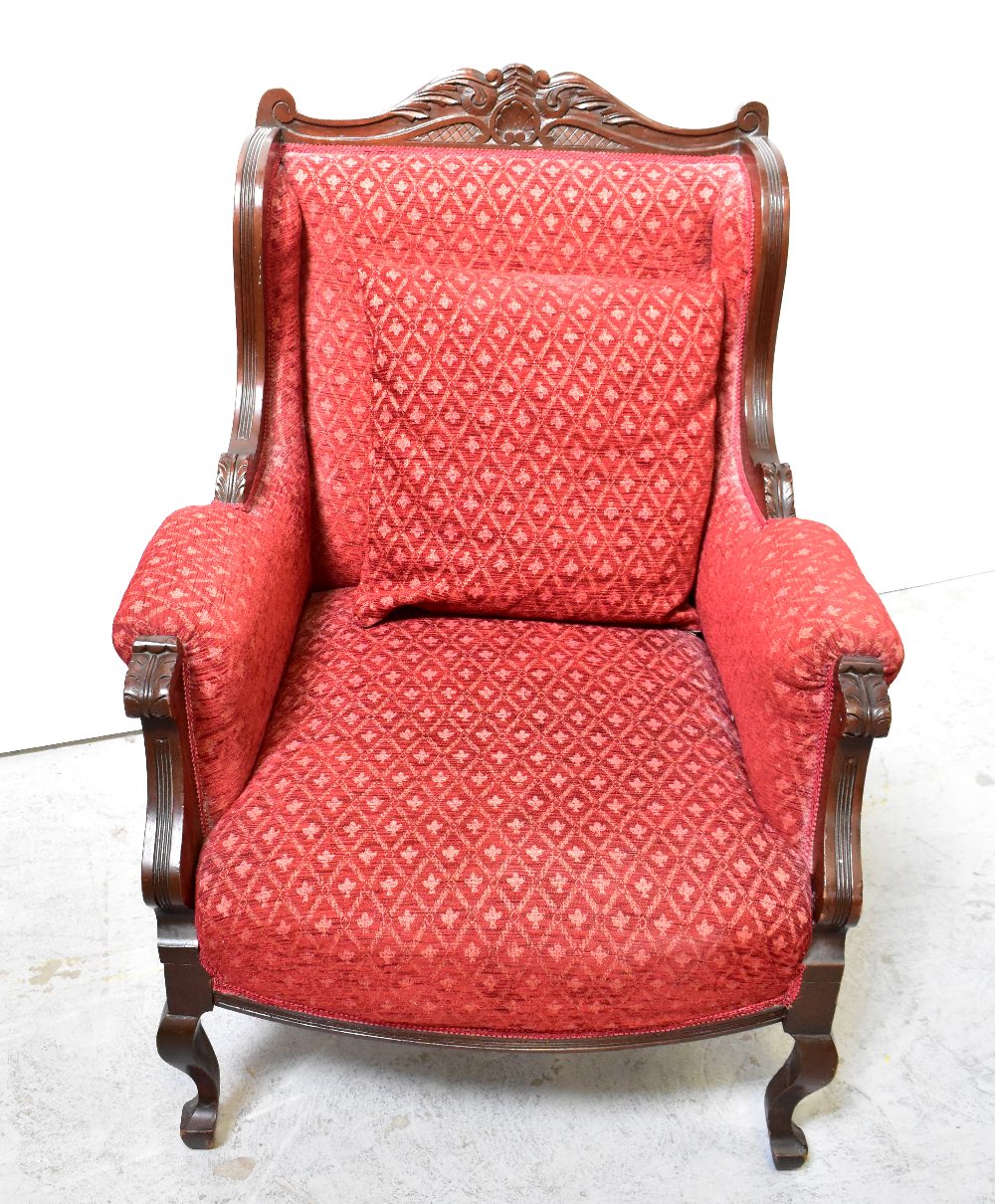 A reproduction walnut framed armchair with red upholstery and carved acanthus leaf decoration, - Image 3 of 3