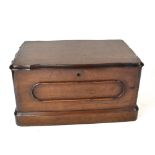 A Victorian mahogany work box with scalloped edged lid and moulding to the sides, on plinth base,