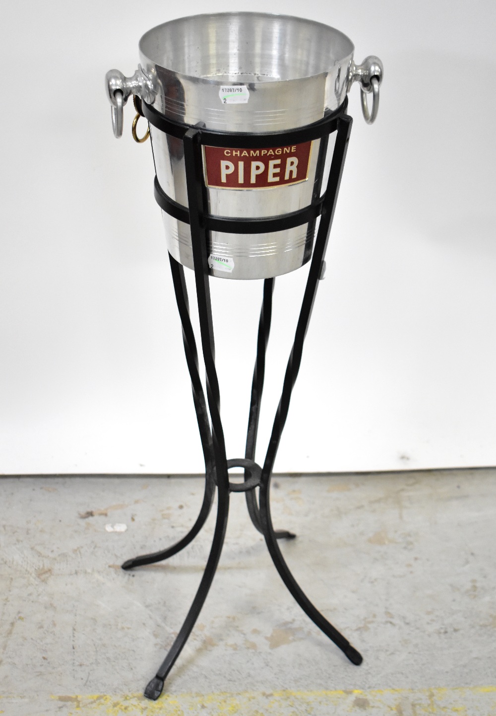 A vintage Piper Champagne bucket in black metal stand, height 73cm,