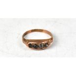 A Victorian 9ct rose gold ring with four pavé set old cut white stones, possibly sapphires, size O,