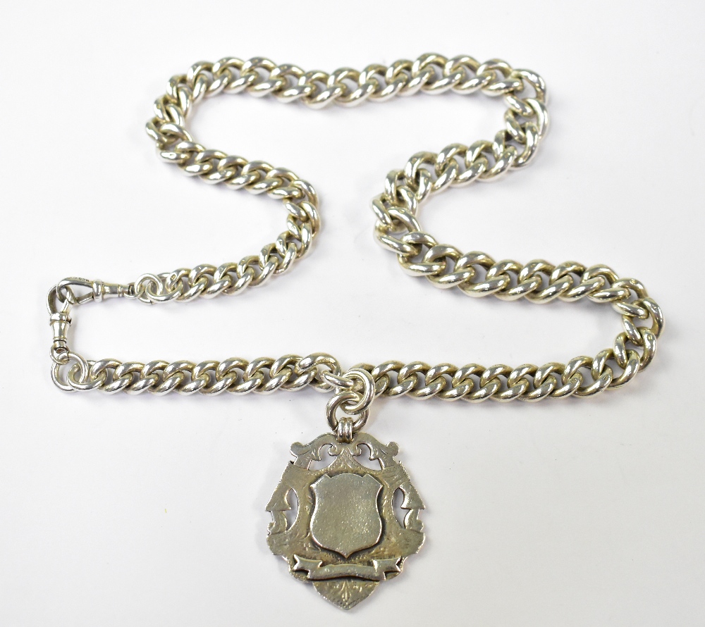 A hallmarked silver heavy and wide watch guard Albert chain with silver shield fob,