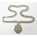 A hallmarked silver heavy and wide watch guard Albert chain with silver shield fob,