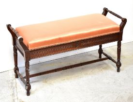 An Edwardian mahogany double piano stool,