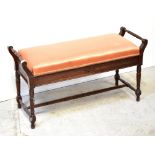 An Edwardian mahogany double piano stool,