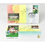 FOOTBALL; two 1986 first day covers, one bearing the signature of German goalkeeper Bert Trautmann,