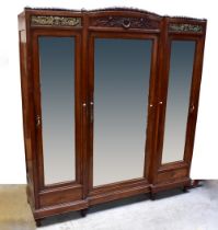 An early 20th century French Empire Revival walnut and kingwood two-piece bedroom suite,