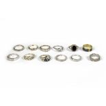 Twelve silver and silver plated rings of various designs, shapes and sizes,
