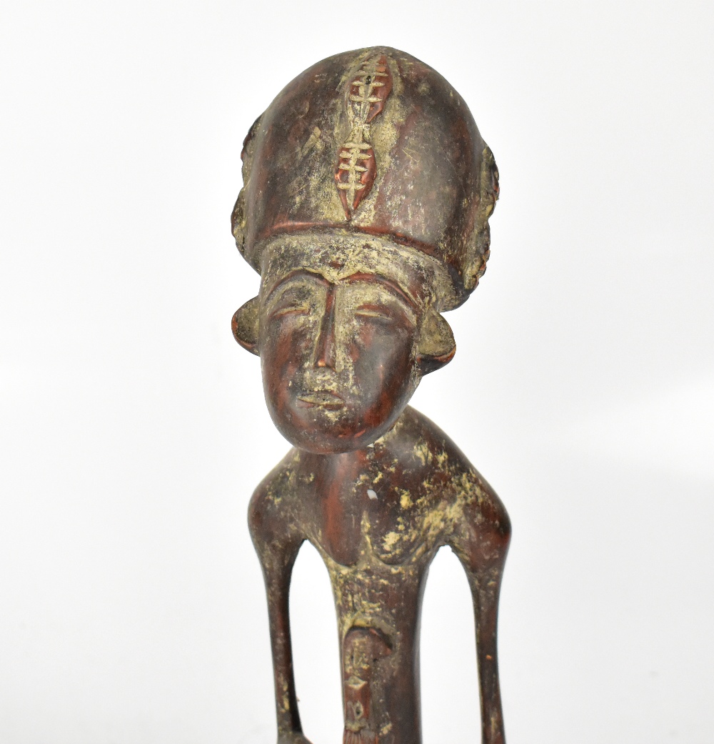 An African carved wooden tribal figure with traces of pigmentation, height 34cm, - Image 2 of 5