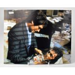 JAMES BOND; three reproduced colour photographs, each bearing the signature of Timothy Dalton (3).