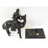 A 19th century or earlier bronze figure depicting a wise man riding a qilin shown with open