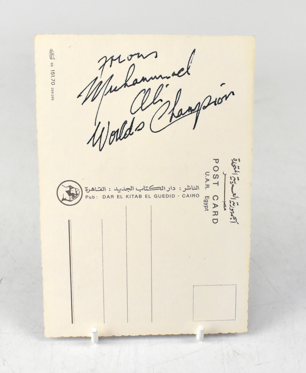 MUHAMMAD ALI; a postcard inscribed from the boxing champion 'World's Champion'.