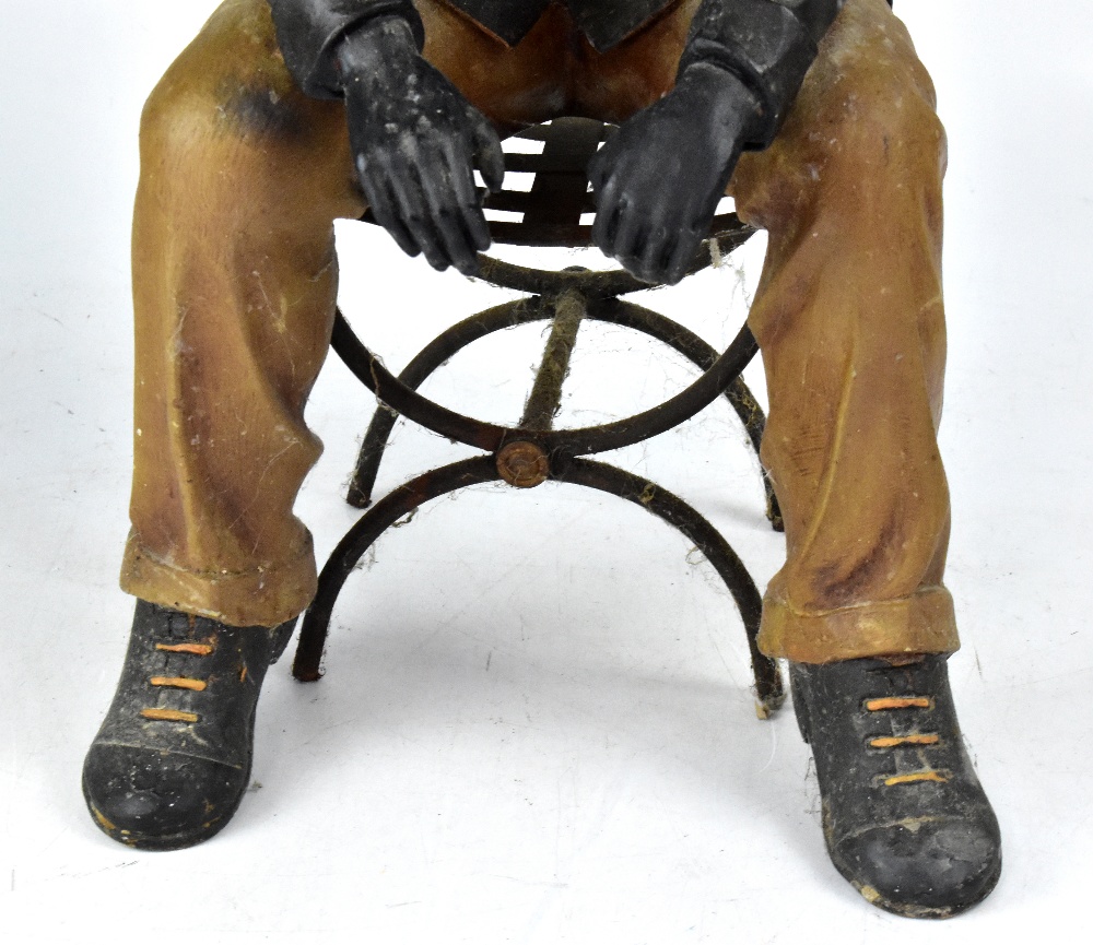 A decorative fibreglass figure of a seated gentleman upon a chair. - Image 3 of 3