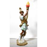 A large fibreglass Blackamoor figural lamp, holding torch aloft, height 140cm.