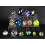 Various glass paperweights with swirl decoration, mottled decoration, some with flower patterns,