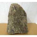 A contemporary carved Lake District stone sculpture of triangular form,