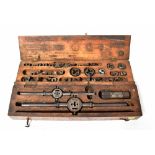 An early 20th century tap and die engineering set in fitted case,