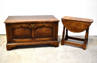 A small swivel top oak gateleg coffee table with turned supports to stile feet,