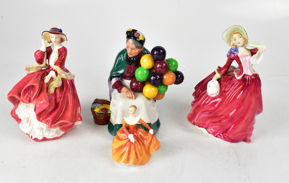 ROYAL DOULTON; four porcelain figures comprising 'The Old Balloon Seller', HN1834 'Autumn Breezes',