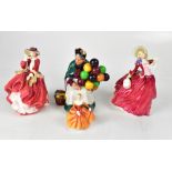 ROYAL DOULTON; four porcelain figures comprising 'The Old Balloon Seller', HN1834 'Autumn Breezes',