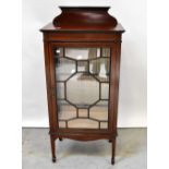 An Edwardian inlaid mahogany display cabinet with galleried top and astragal glazed single door,