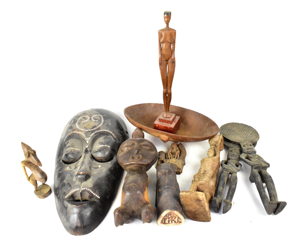 Various African carved wooden items to include masks, statues, bowls, stylised figures, etc,