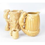 A Sylvac moulded jug in the form of a fern, with handle moulded as two rabbits, in light brown,