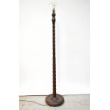 An early 20th century oak standard lamp, height 168cm.