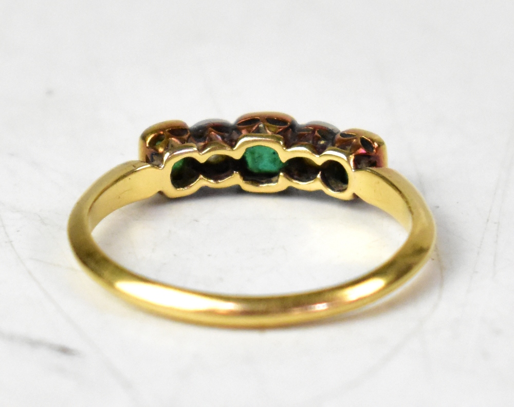 An 18ct yellow gold five-stone ring set with alternating emerald cut emeralds and rose cut diamonds, - Image 3 of 3