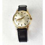 TISSOT; a gentlemen's 9ct gold watch, the silvered dial set with raised baton numerals,