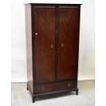 STAG; a two-piece mahogany bedroom suite comprising a double wardrobe,