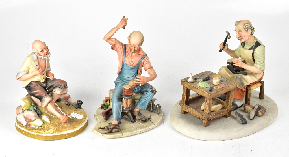 Three Capodimonte figures comprising a shoemaker holding last with boot in one hand and hammer in