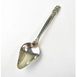 GEORG JENSEN; a silver spoon with scroll and heart-shaped finial, marked to back 'Georg Jensen 925',