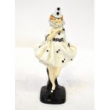 ROYAL DOULTON; an early porcelain figurine, HN644 'Pierette', female harlequin on base,