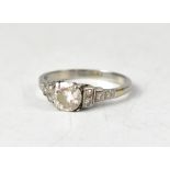 A platinum and diamond ring, the claw set brilliant cut diamond approx 1ct,