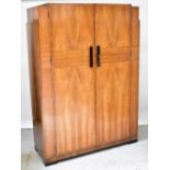 WARING & GILLOW; a satin walnut Art Deco style two-door wardrobe with ebonised handles,