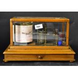 CHADBURNS LTD; a barograph within a glazed wooden case,