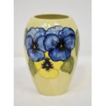 WALTER MOORCROFT; a mid-20th century vase with tube-lined coloured pansies and leaves,
