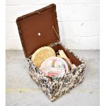 A vintage tapestry covered work box containing various items of upholstery equipment to include