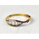 An 18ct yellow gold five-stone ring, the five graduated diamonds set in a white gold mount,