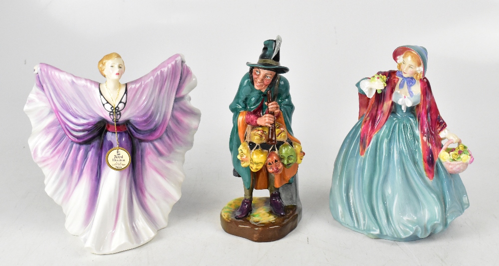 ROYAL DOULTON; three porcelain figures comprising HN2103 'The Mask Seller',