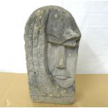 A contemporary carved Lake District stone sculpture of triangular form,