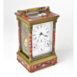 A reproduction brass and champlevé enamel decorated carriage clock with swing loop handle and white