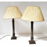 A contemporary pair of bronzed table lamps in the form of Doric columns, to stepped plinth bases,