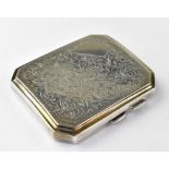 A George V hallmarked silver breast pocket cigarette case, with all-over floral scroll decoration,